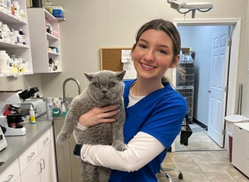 pet wellness woman hugging dog<br />